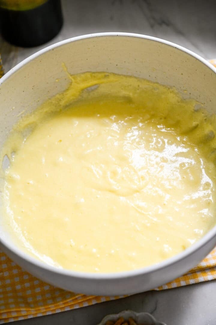 butter, sugar and eggs mixed in a bowl.