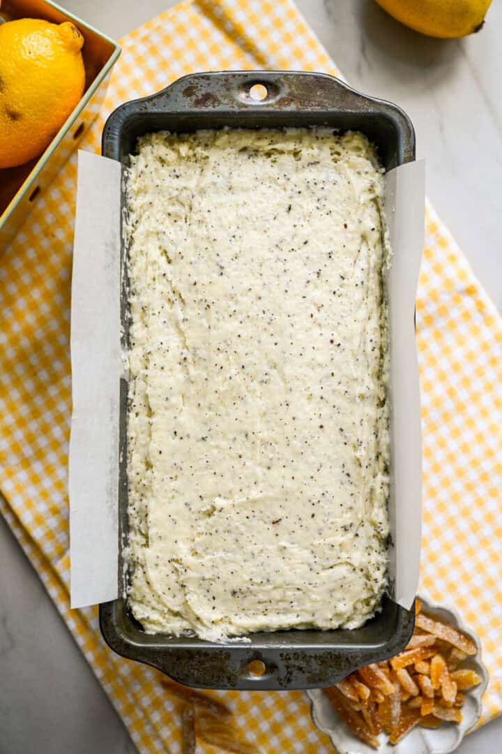 earl grey yuzu cake batter in a loaf pan before baking.