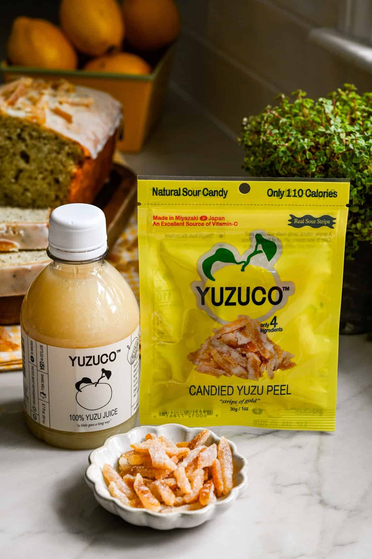 side view of YUZUCO yuzu juice and candied yuzu peel.