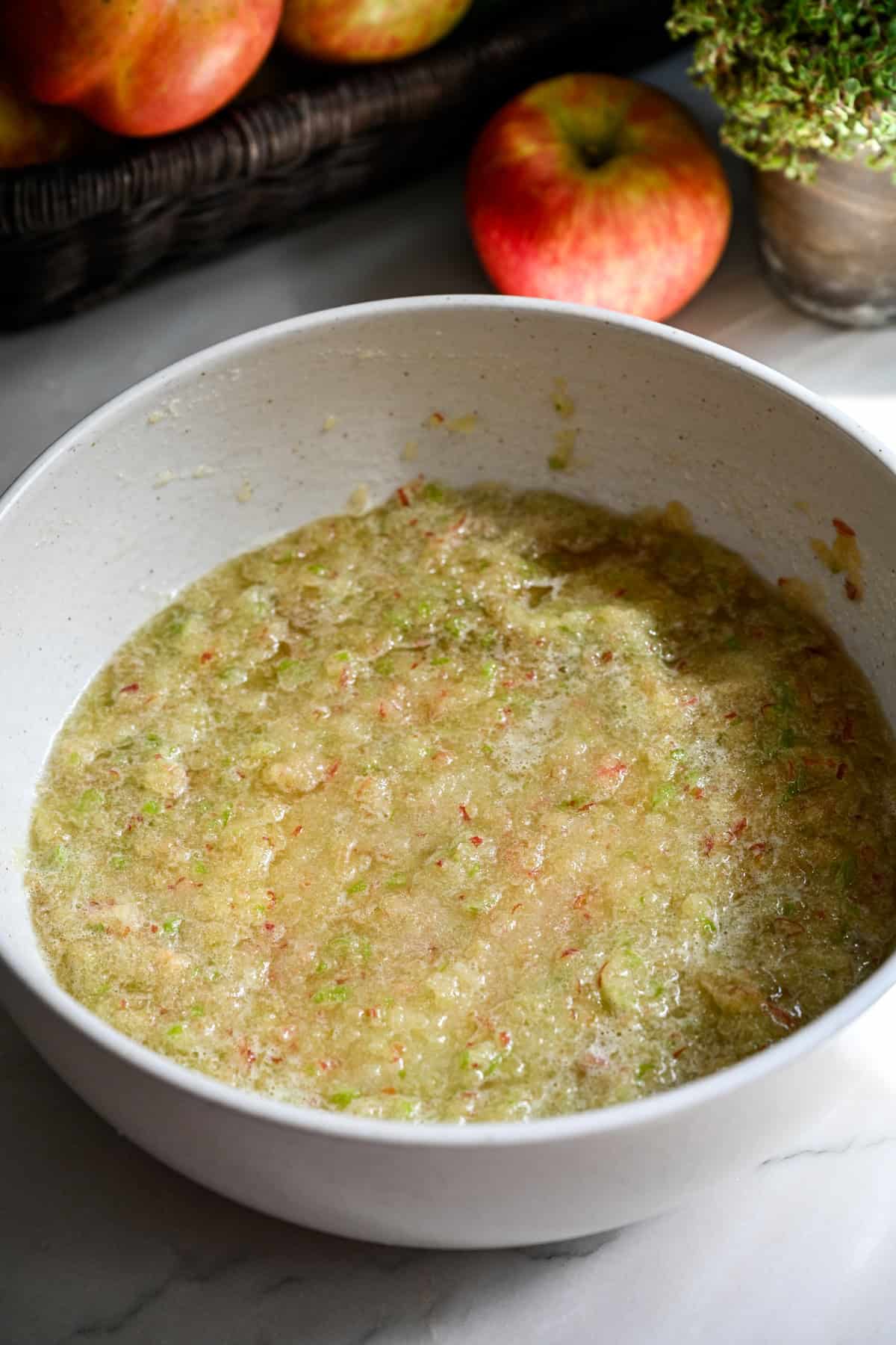 Overhead view of apple mixture after adding in sugar and lemon juice.