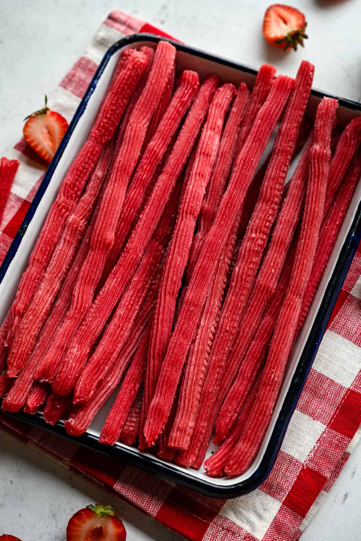 Overhead view of twizzlers on a tray.