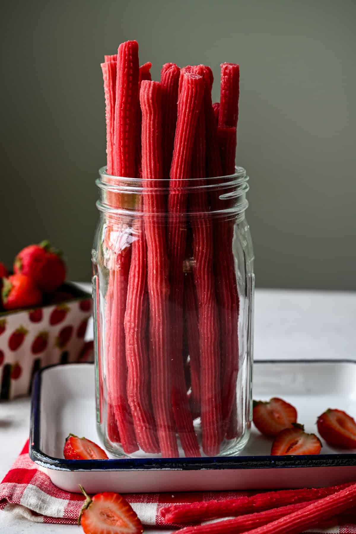 Front view of twizzlers in a jar.