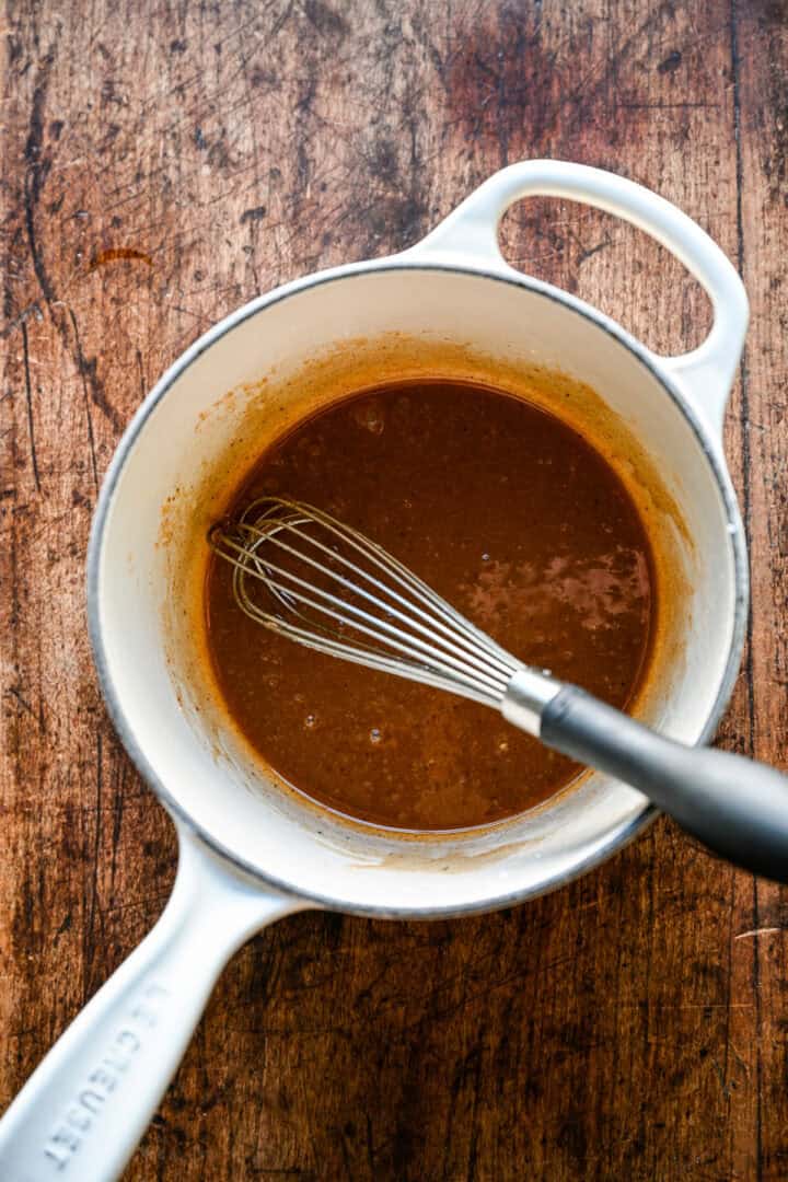 Overhead view of liquid portion of apple pie filling.