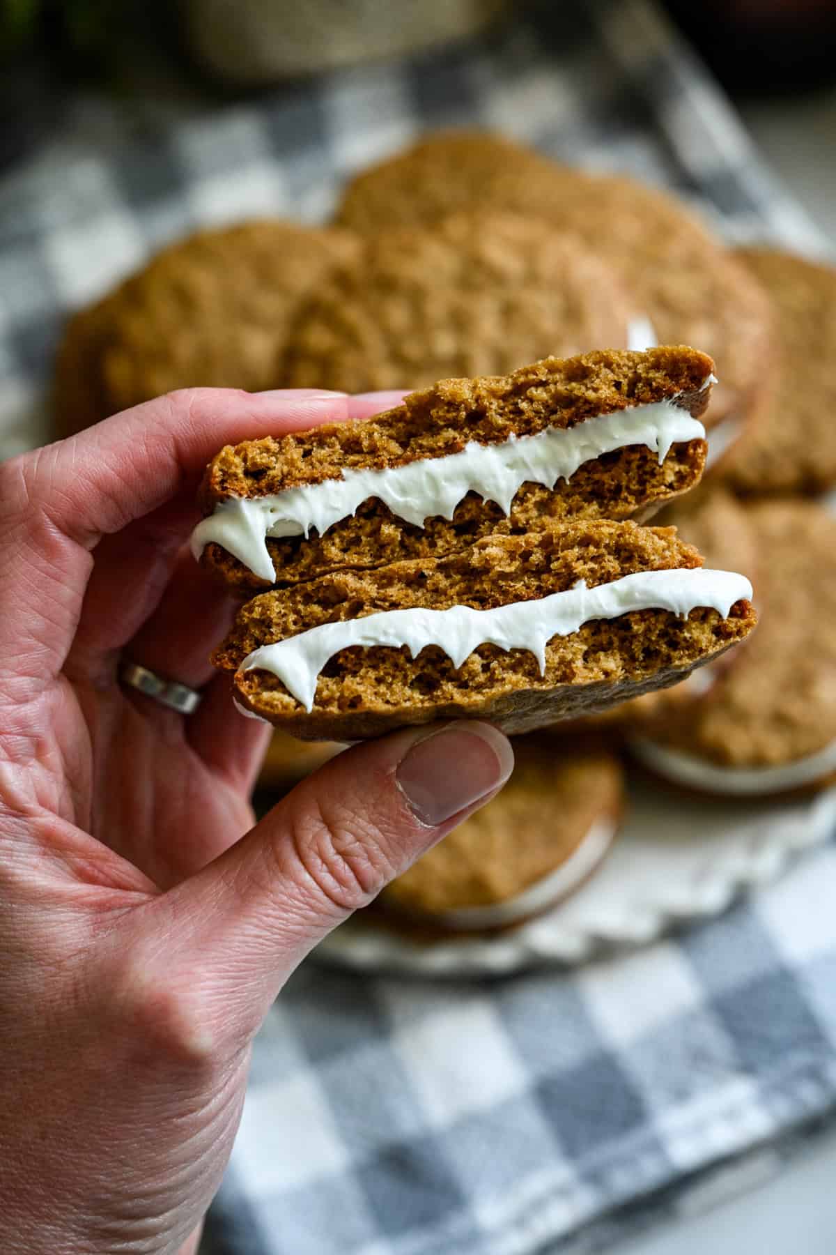 Front view of oatmeal cream pie broken in half.