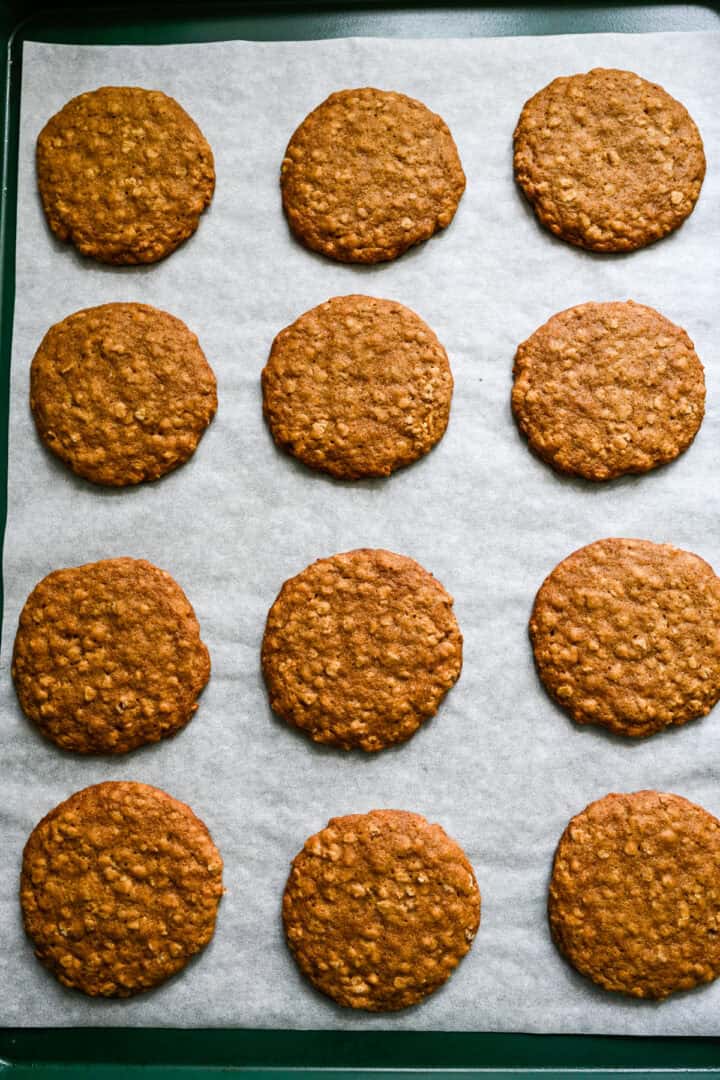Oatmeal cream pies on. a sheet after baking.