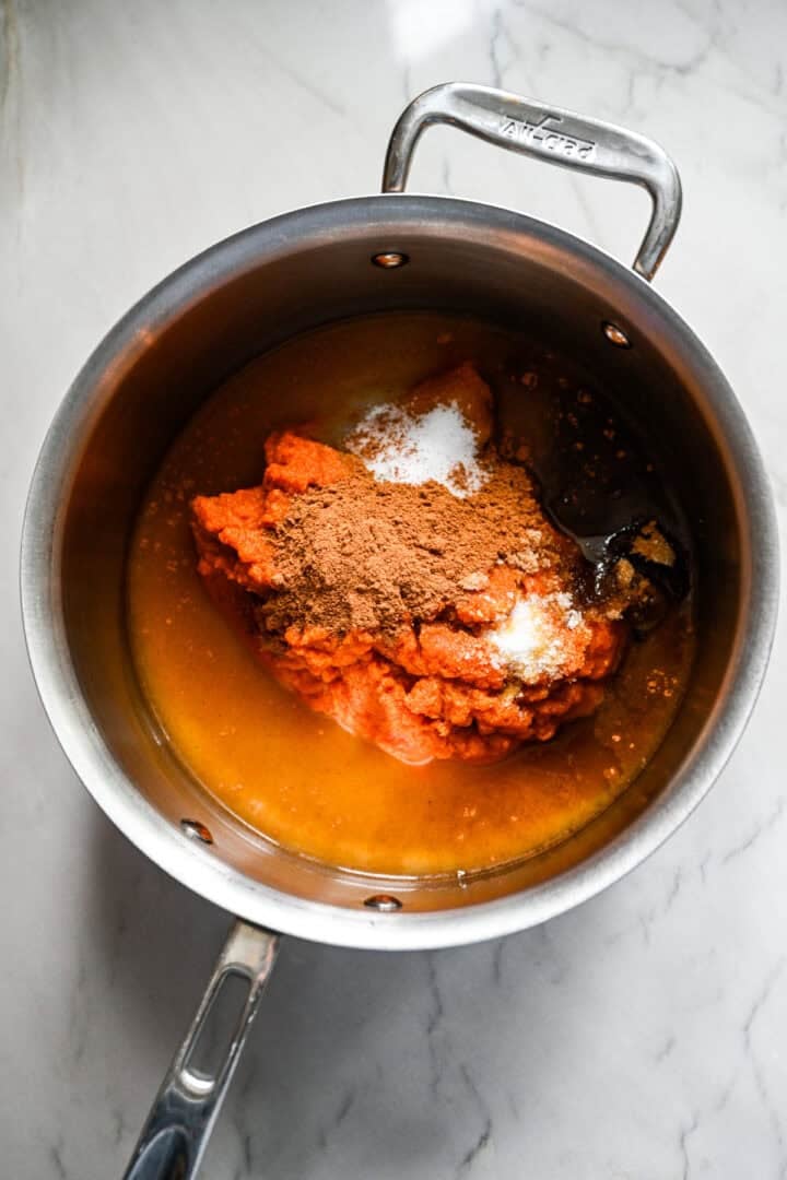 All ingredients for pumpkin butter in a saucepan before stirring together.