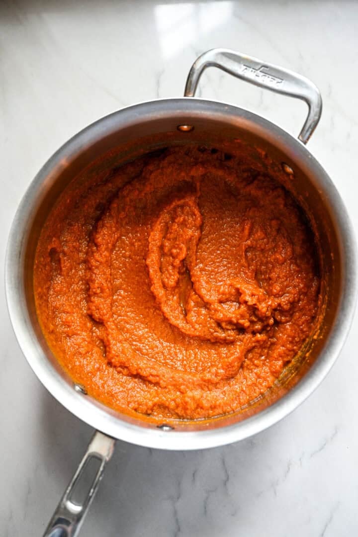 All ingredients for pumpkin butter in a saucepan after stirring together.